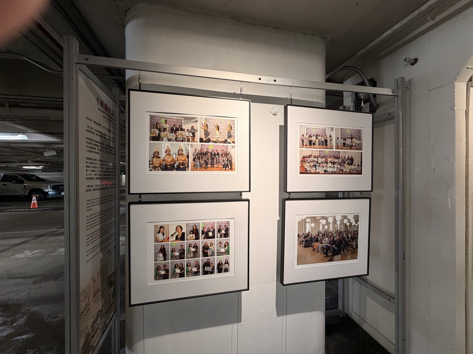 Framed community photographs on display inside the garage